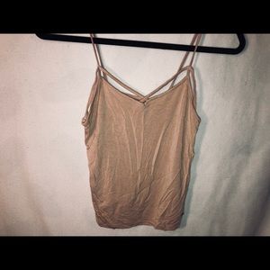Tank with criss cross detailing